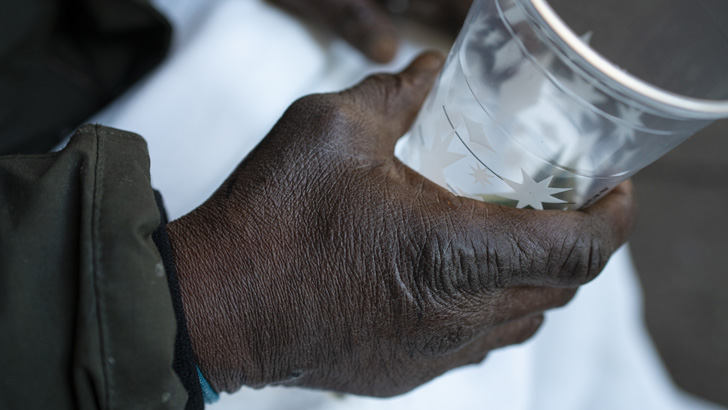 A homeless man holds out a cup for donations December 23, 2020 in New York City. The number of homeless single adults is estimated to be 115 percent higher than it was ten years ago. (Photo by Robert Nickelsberg/Getty Images)