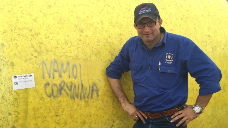 Tinder 'love rat' Brett Joseph stands in front of hay bail at Daisy Armstrong's family property.