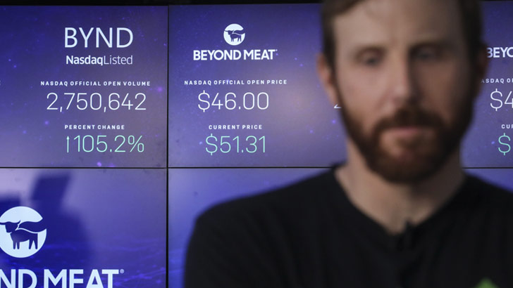 Beyond Meat CEO Ethan Brown speaks to a journalist after his company's stock began trading at the Nasdaq MarketSite, May 2, 2019 in New York City.