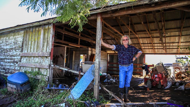 TAREE, AUSTRALIA - MAY 24: Darryl Hammond, who runs a hay silage business, poses after inspecting his flood-damaged property in Glenthorne on May 24, 2025 in Taree, Australia. Catastrophic floods have recently struck New South Wales, with more than 10,000